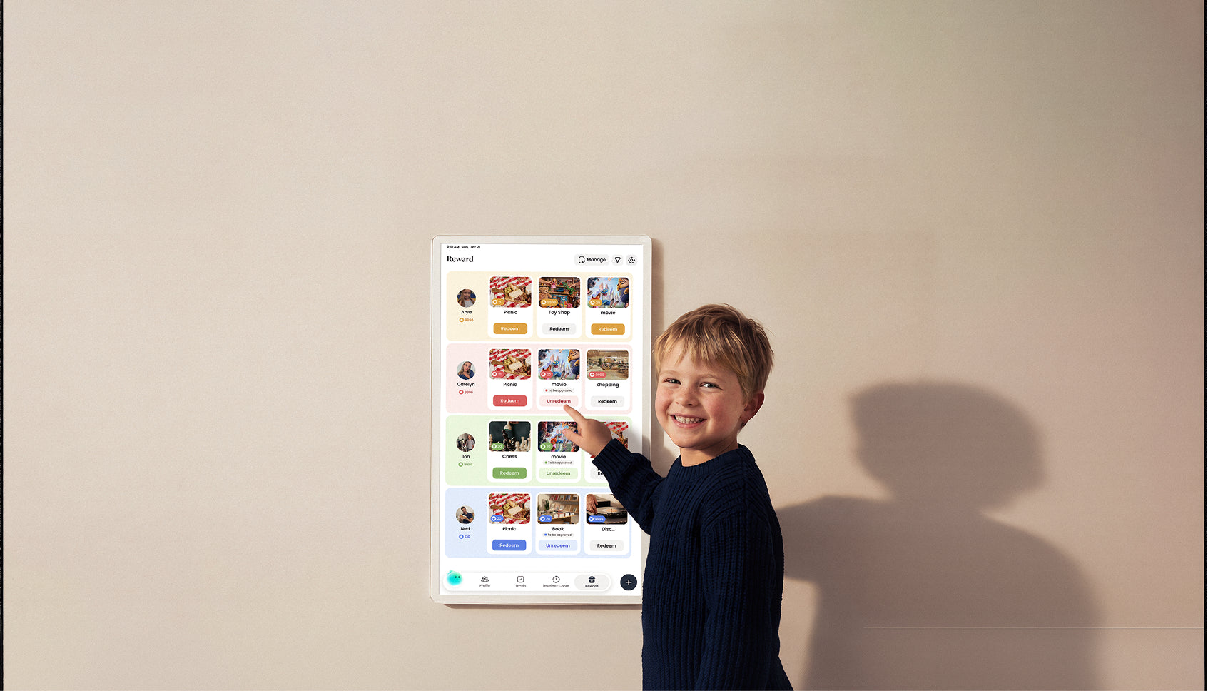 Boy smiling and pointing the Reward interface on Cozyla digital calendar