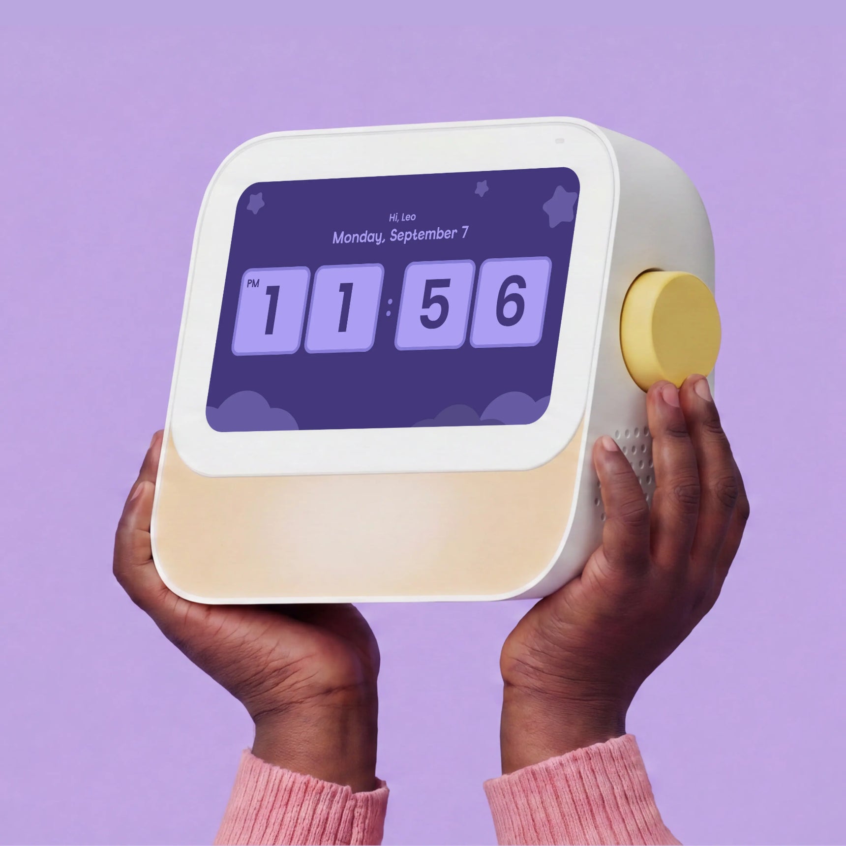 A person holds Cozyla Routie, a smart daily routine helper for kids