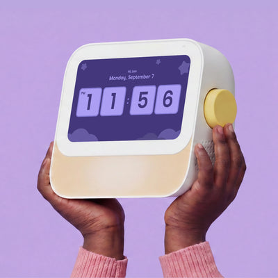 A person holds Cozyla Routie, a smart daily routine helper for kids