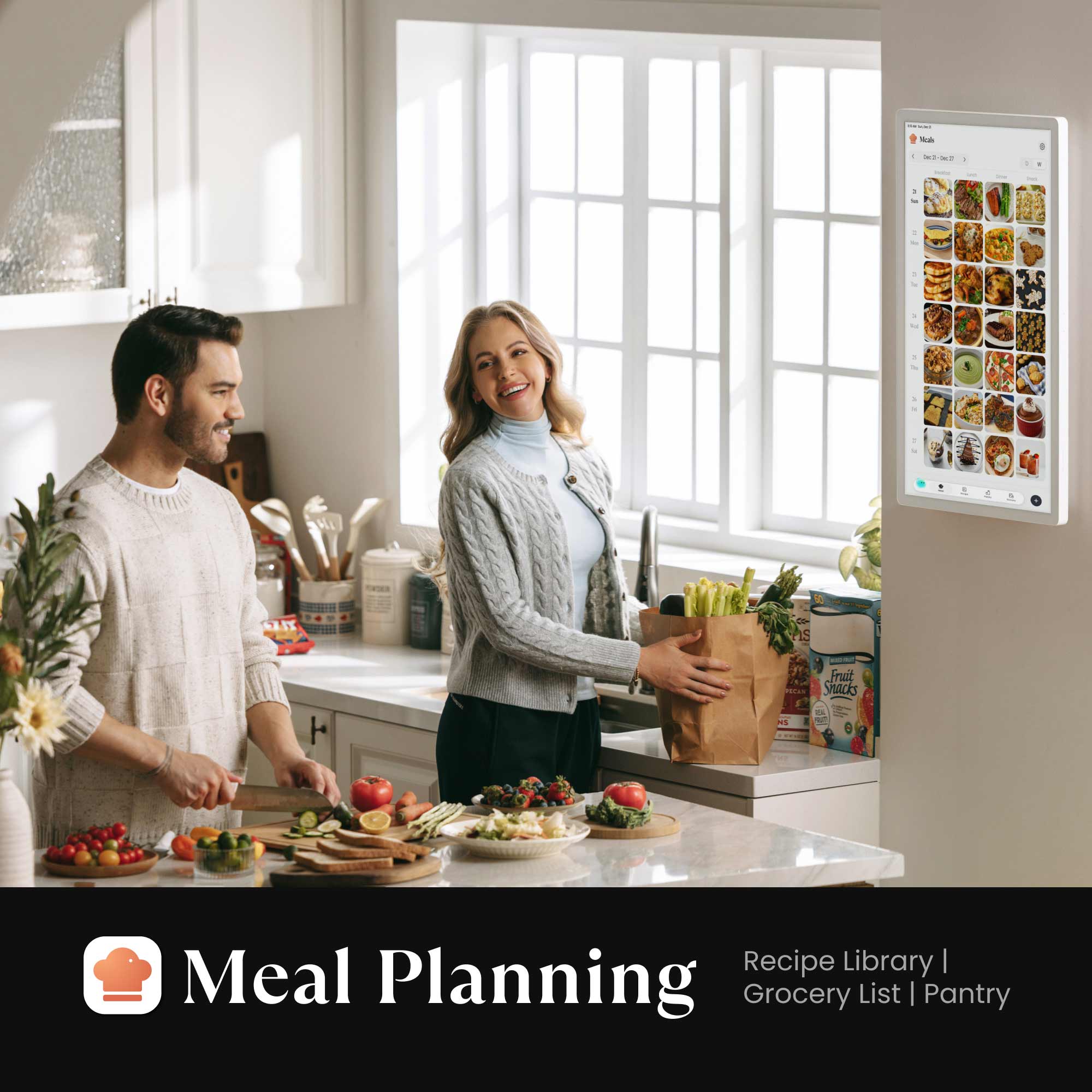 Couple in a kitchen preparing a meal with a Cozyla 32-inch Calendar+ Gen 2