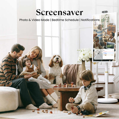 A happy family of four spending time together with a Cozyla digital Calendar Plus Go displaying a family photo nearby