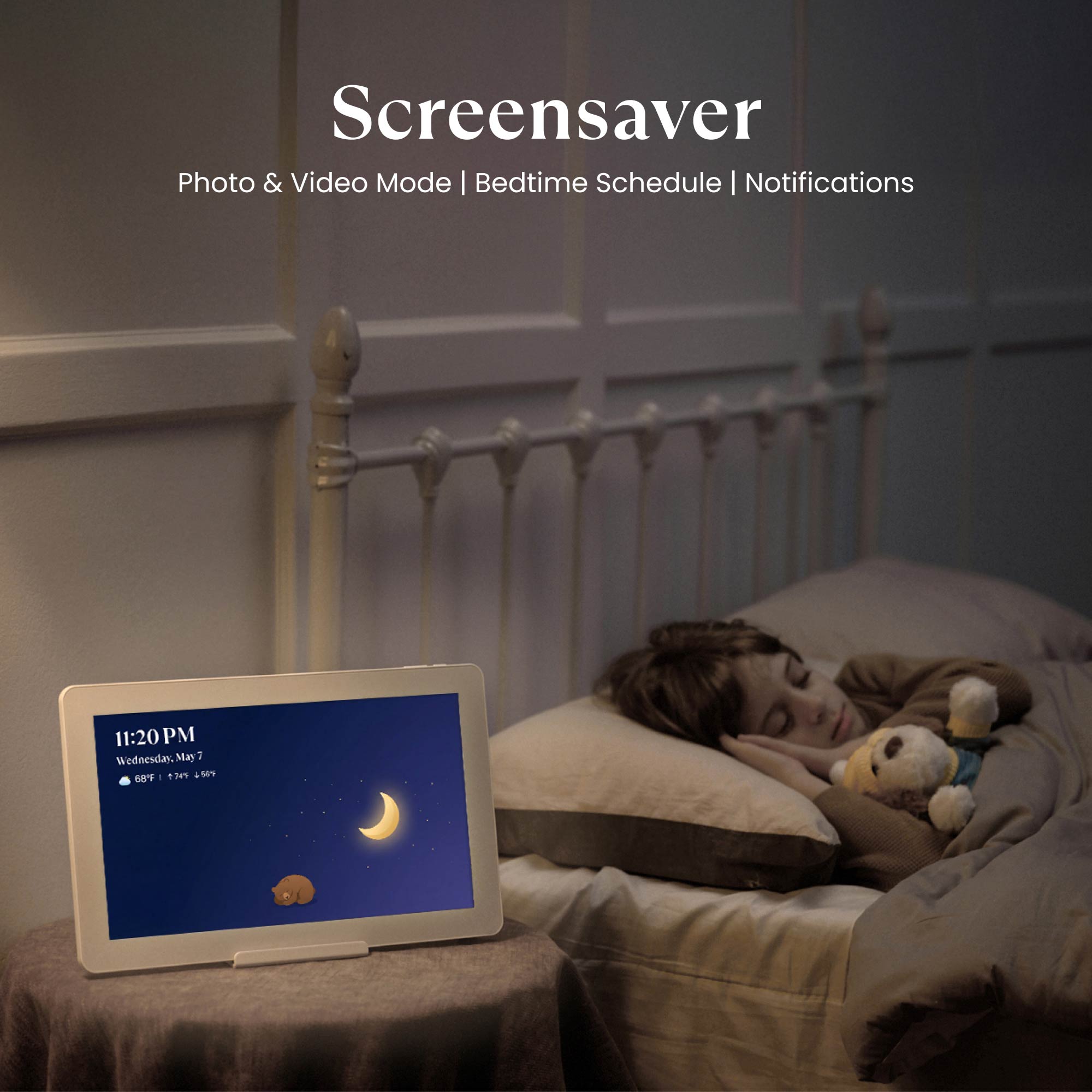 A peacefully sleeping child beside a Cozyla digital calendar displaying a "Goodnight, Moon" screensaver